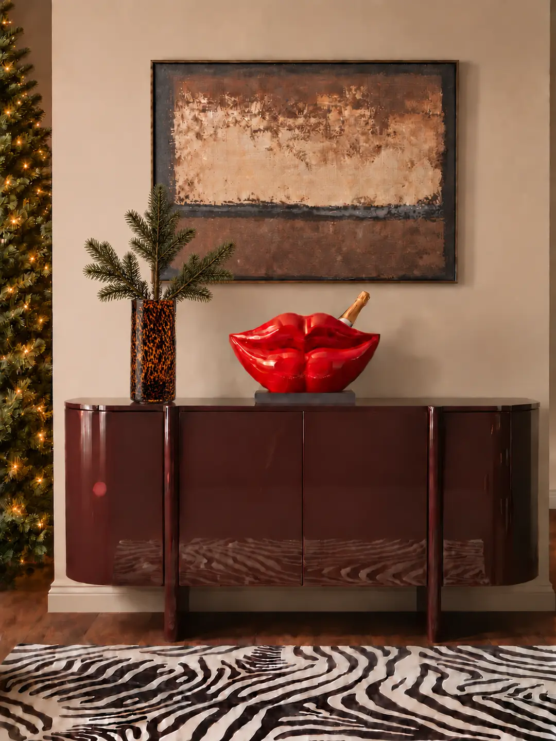 A high-gloss burgundy console with a bold red lips centerpiece.